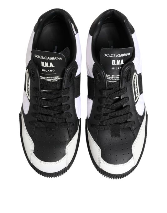 Pair of black and white leather sneakers with brand name on side