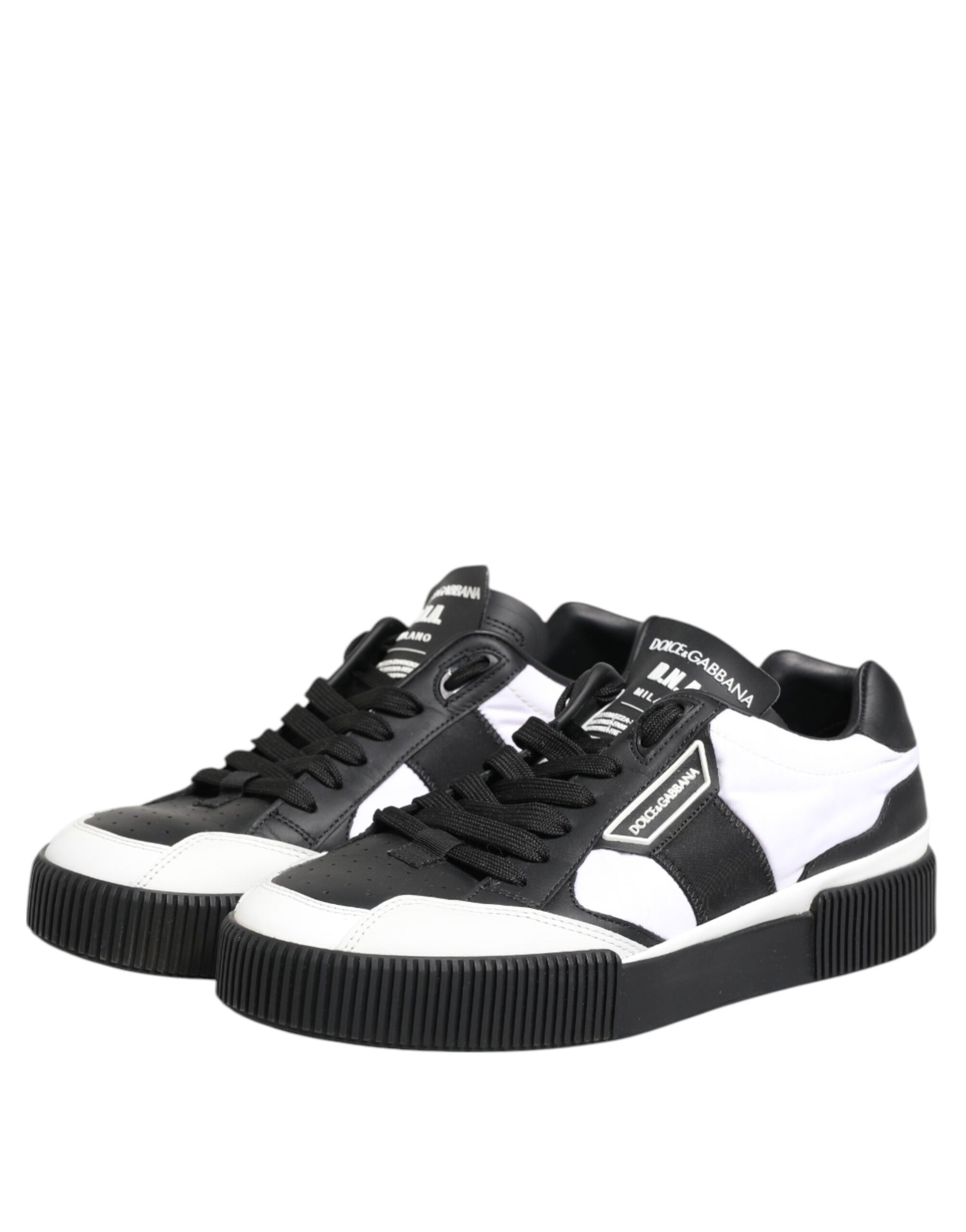 Black and white leather sneakers with laces, featuring a low top design