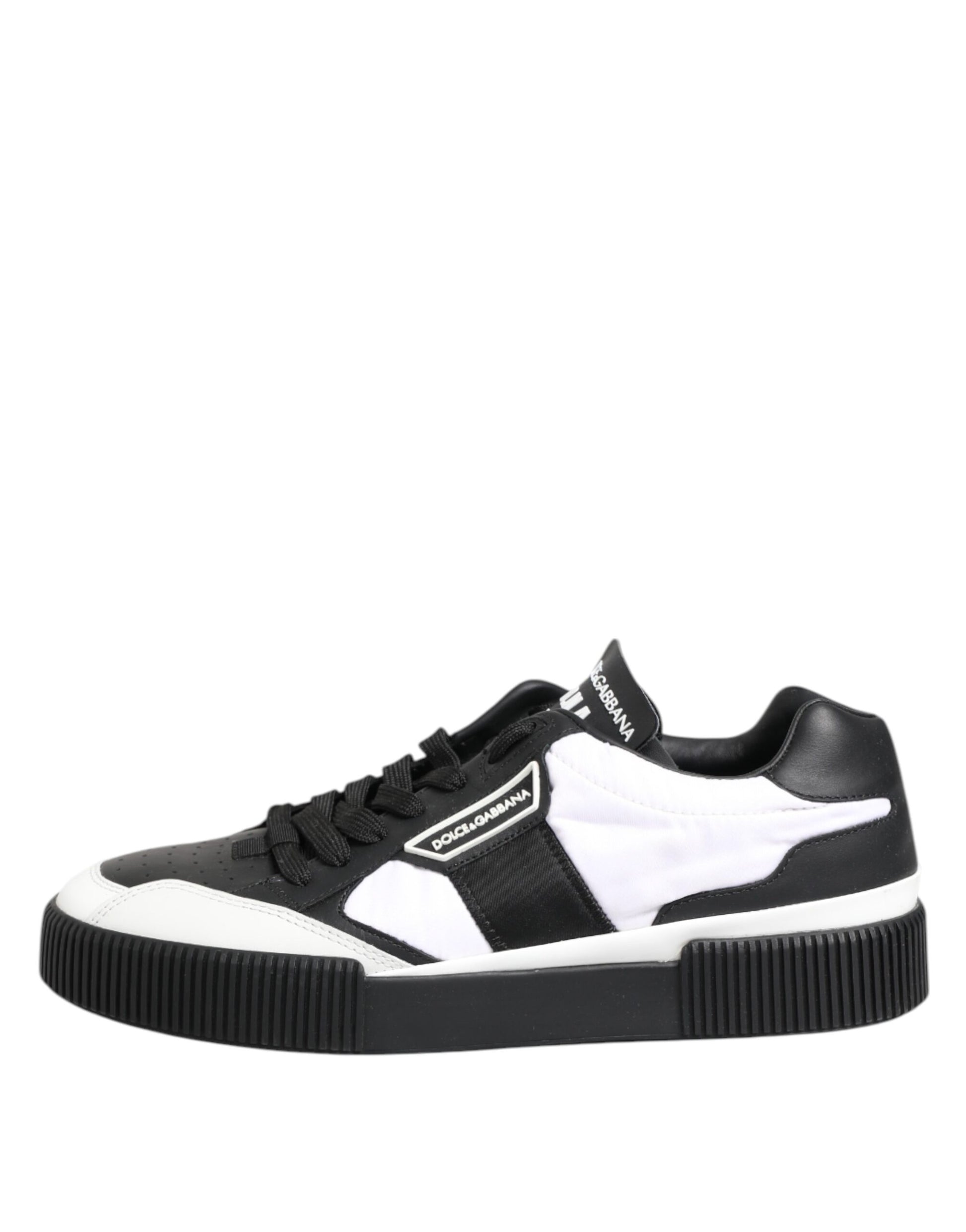 Black and white leather sneakers with laces, featuring a low top design