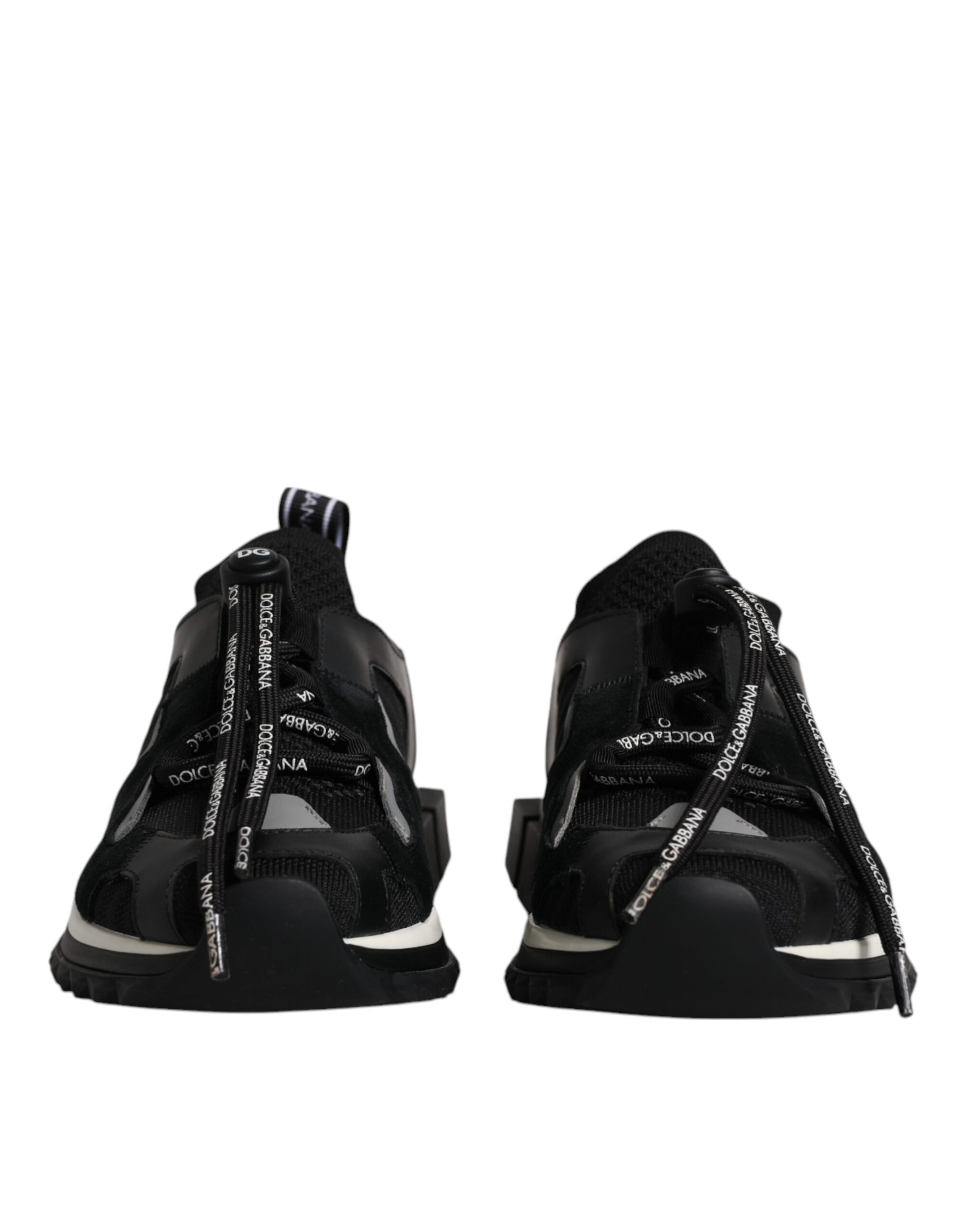 Pair of black sneakers with white laces and a patterned design on the side