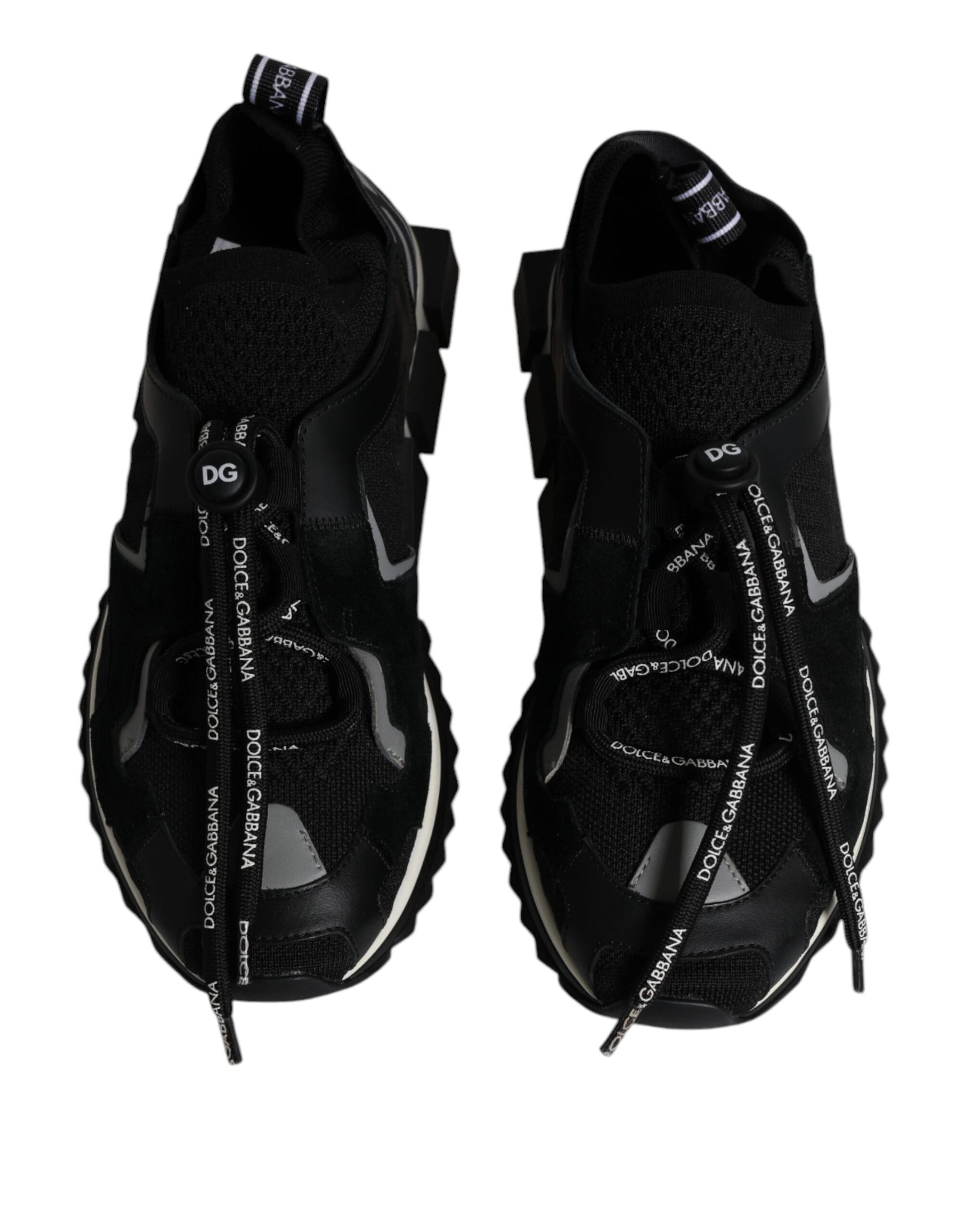 Pair of black and white sneakers with laces tied in a bow