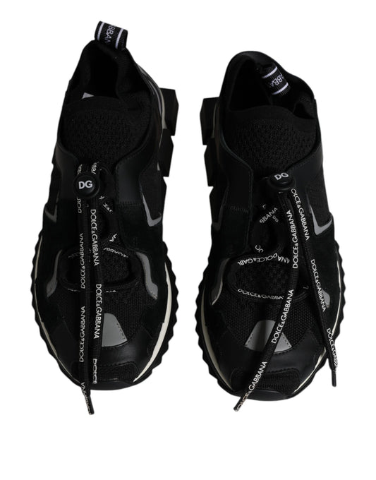 Pair of black and white sneakers with laces tied in a bow