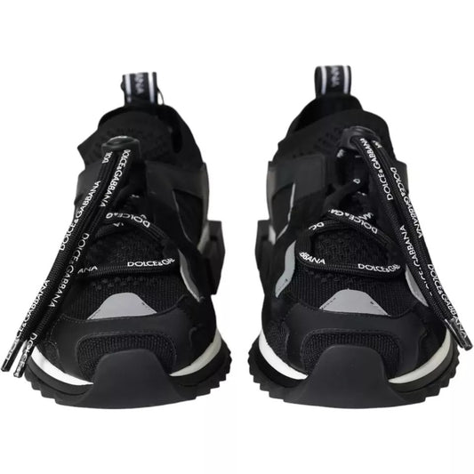 Pair of black and white sneakers with logo on side
