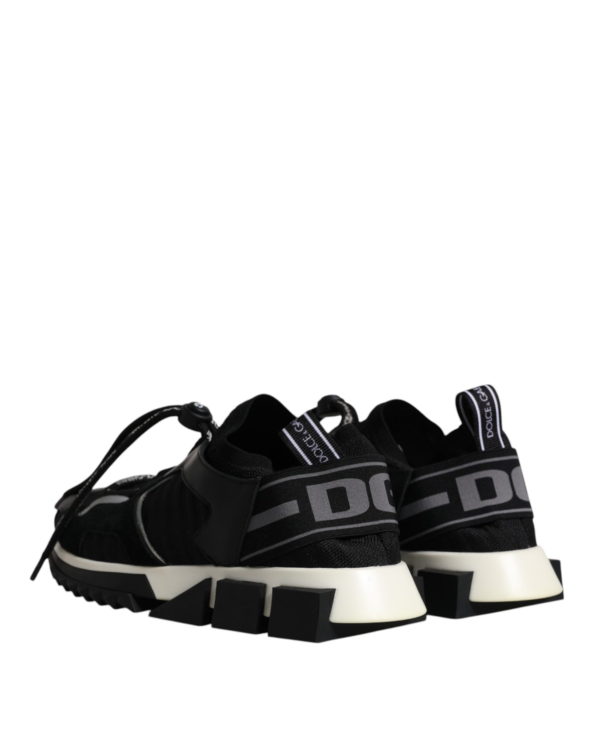 Pair of black and white sneakers with a knit upper