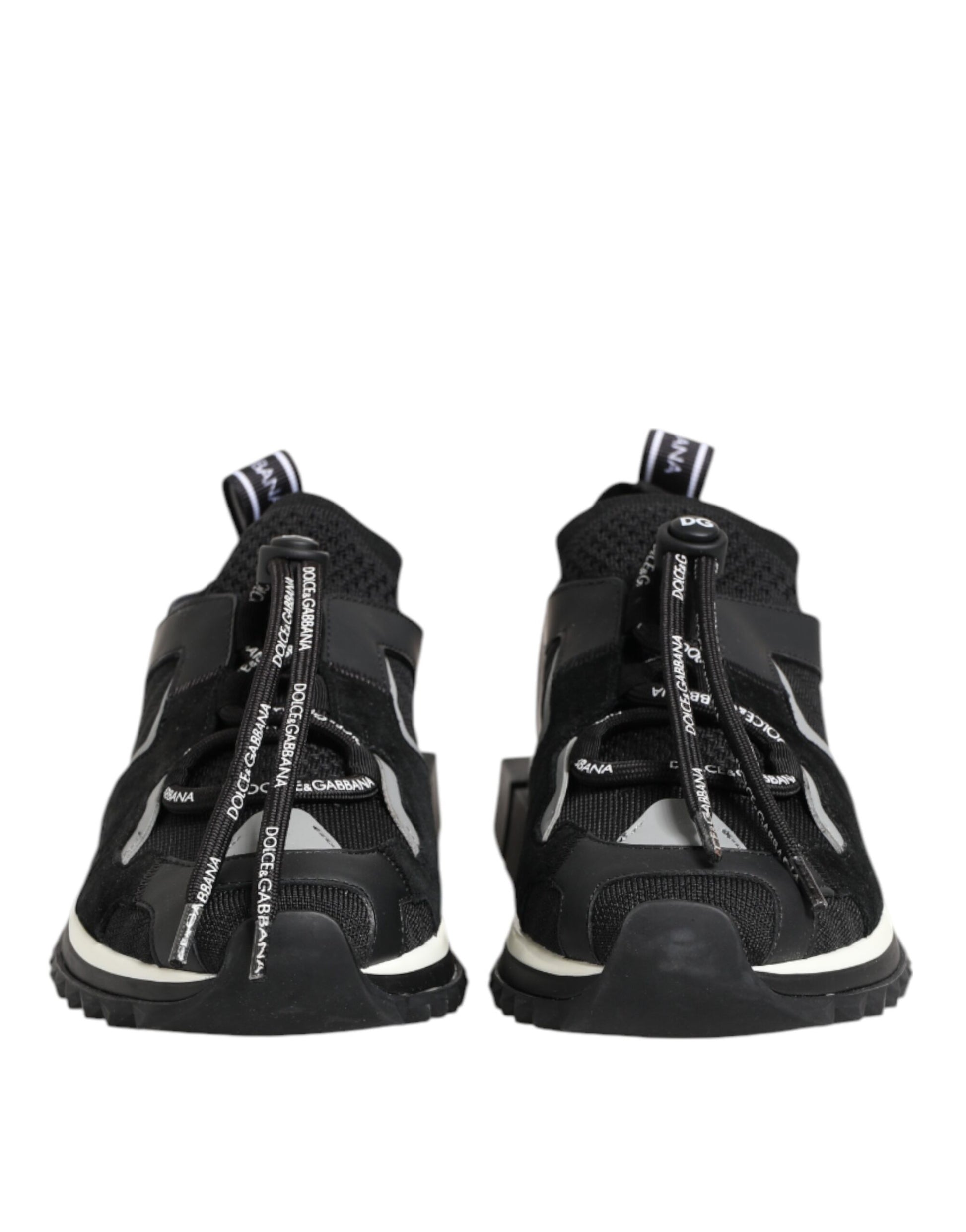 Pair of black baby shoes with white soles