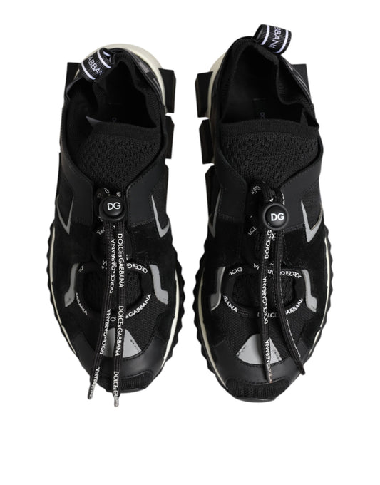 Pair of black sneakers with white laces and a logo on the side