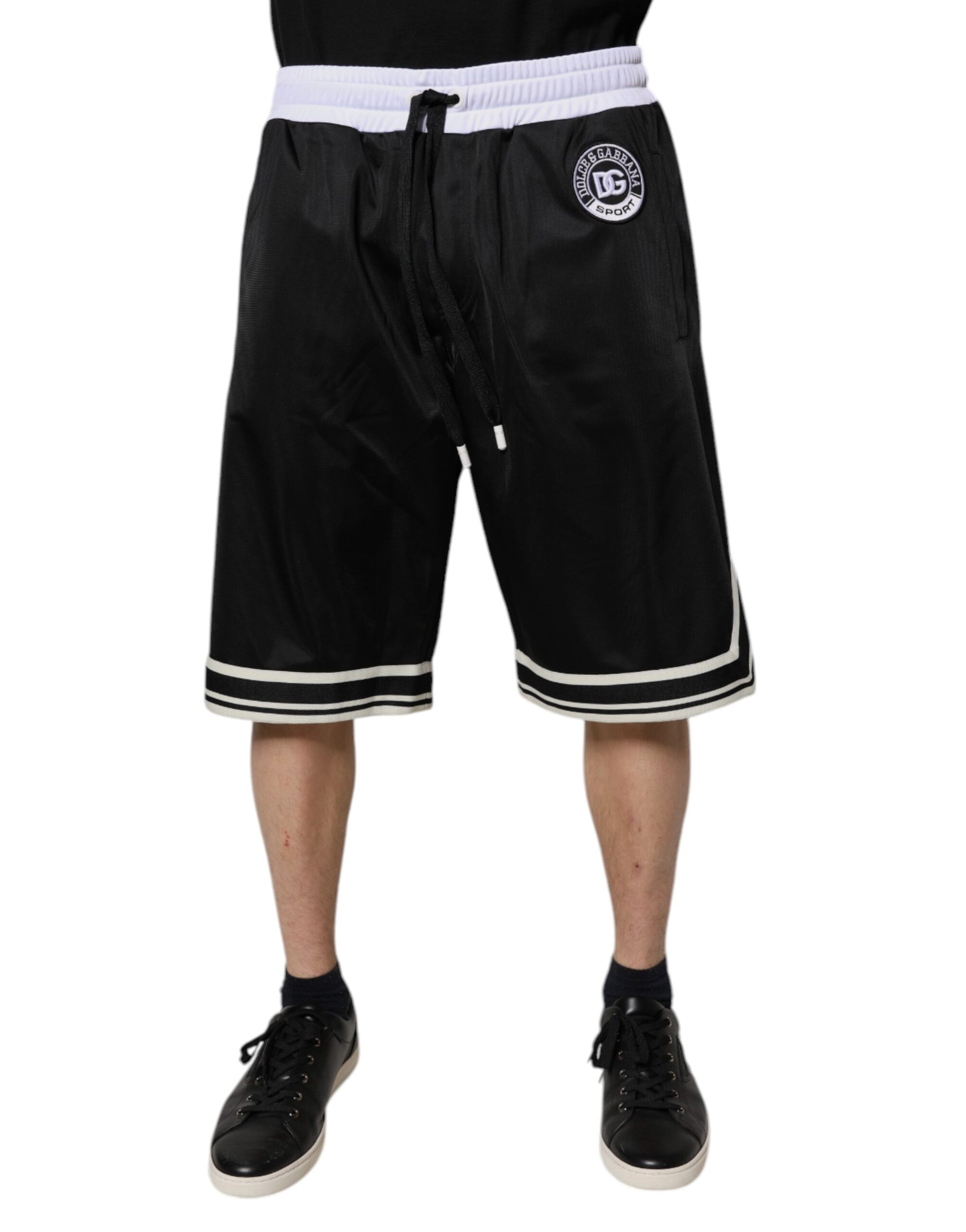 A pair of black and white men's bermuda shorts