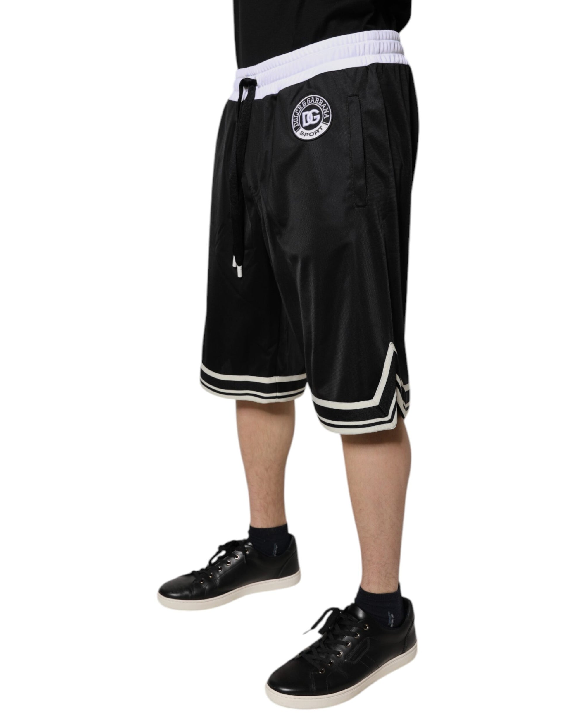 A pair of black and white men's bermuda shorts