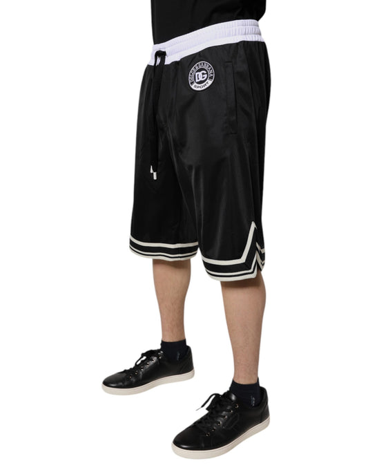 A pair of black and white men's bermuda shorts