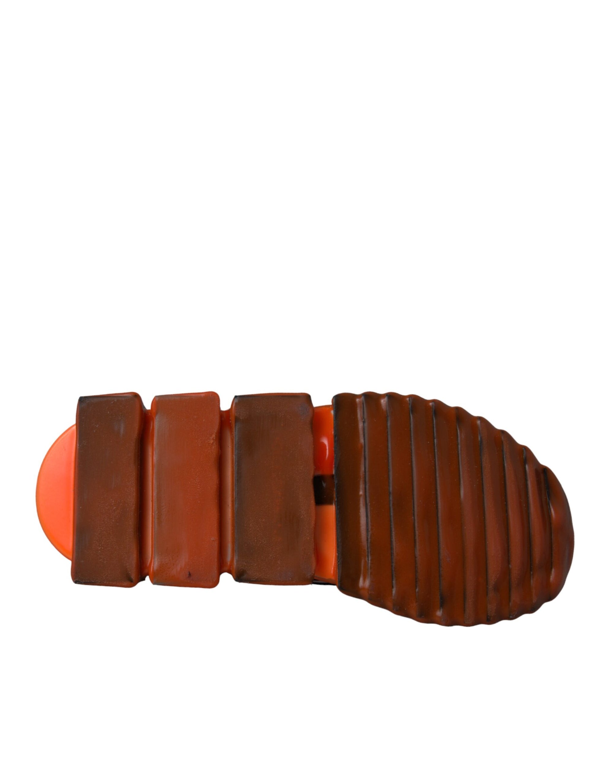 Shoe with red sole and brown straps