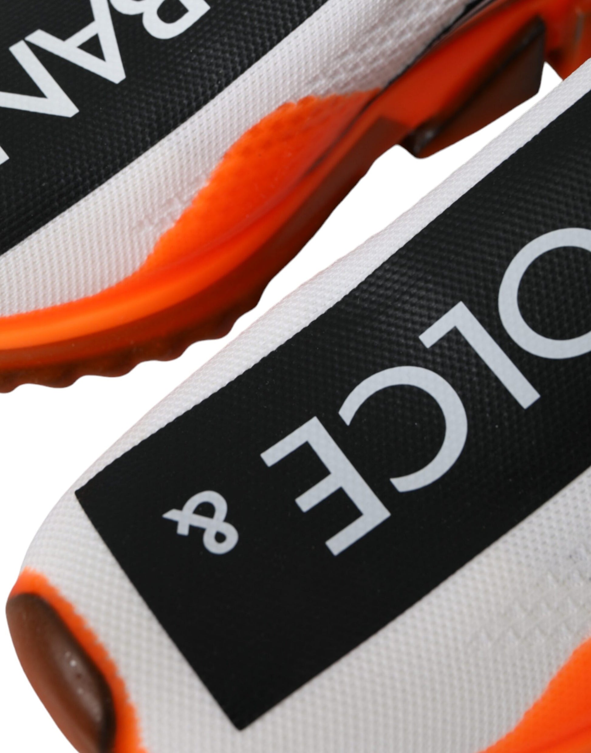 Pair of athletic shoes with orange and black colors