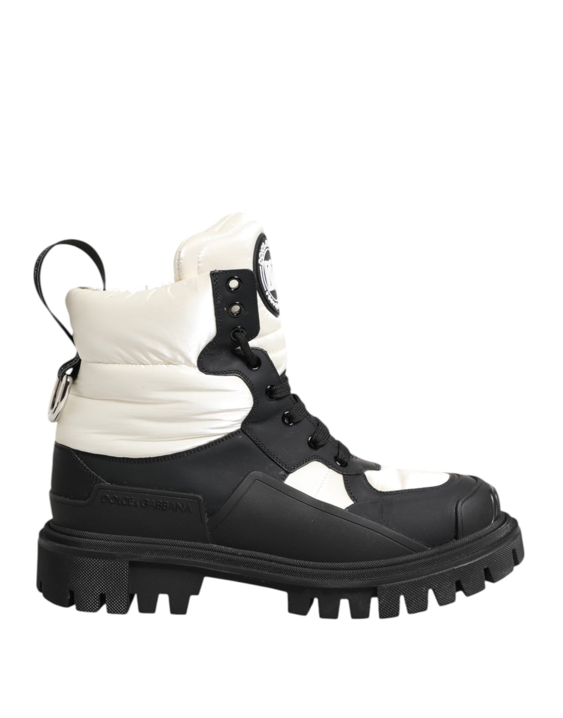 Black and white snow boot with laces and buckles