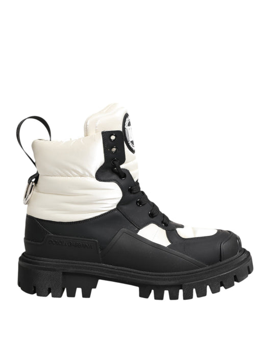 Black and white snow boot with laces and buckles