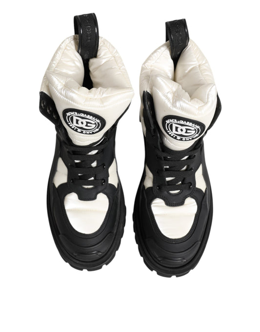 Pair of black and white sneakers with a logo on the side