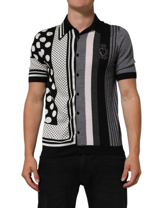 Man wearing a checkered shirt with black, white, gray, and pink stripes