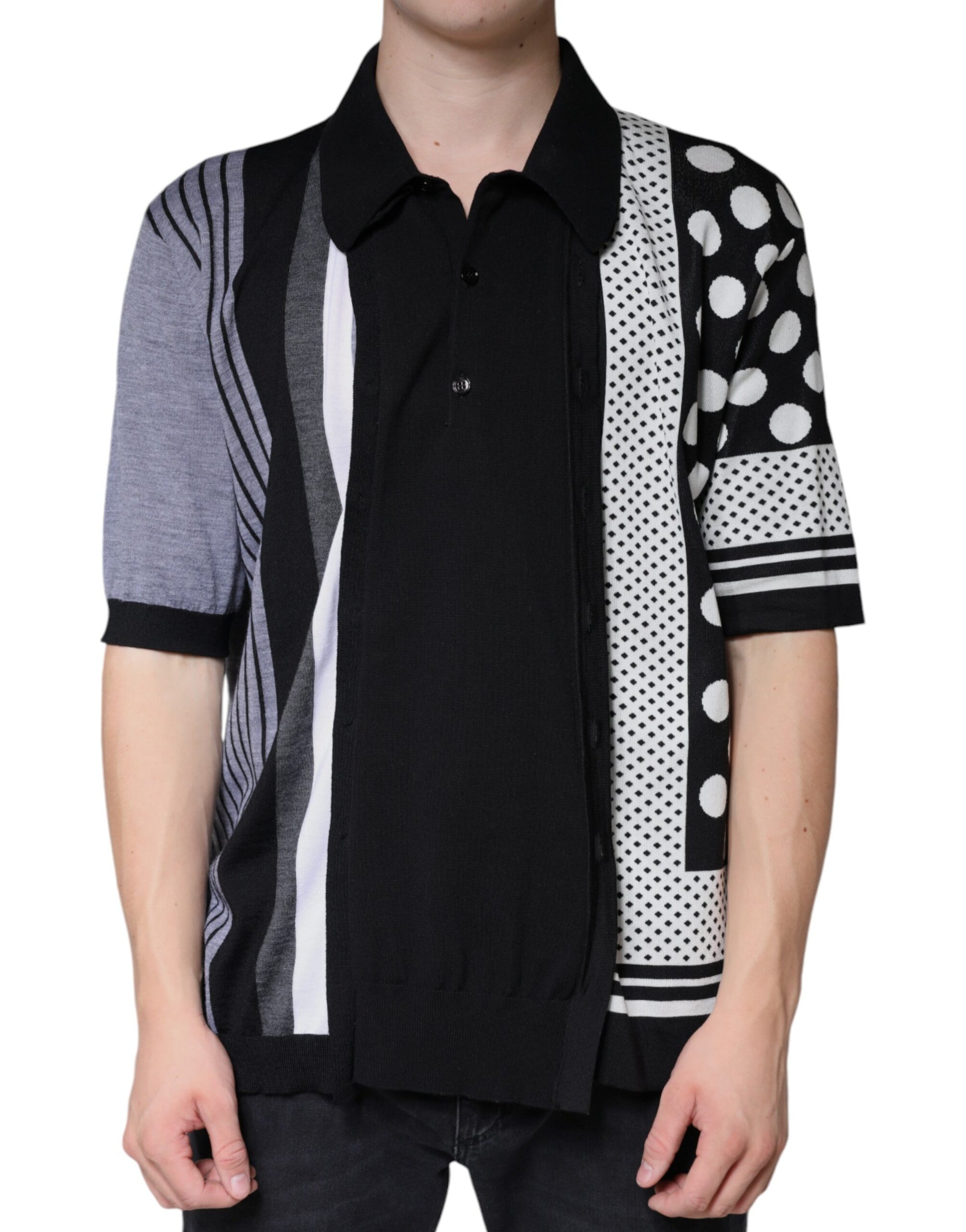 Man wearing a black shirt with white stripes and a colorful vest over it