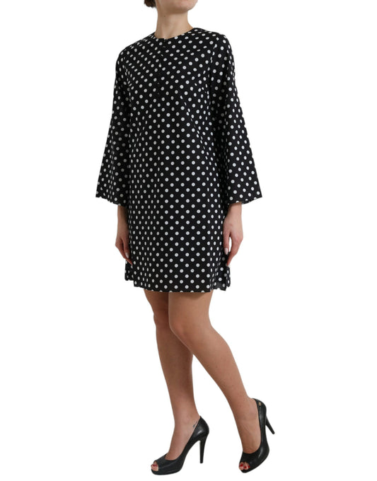 A black and white polka dot nylon shift mini dress