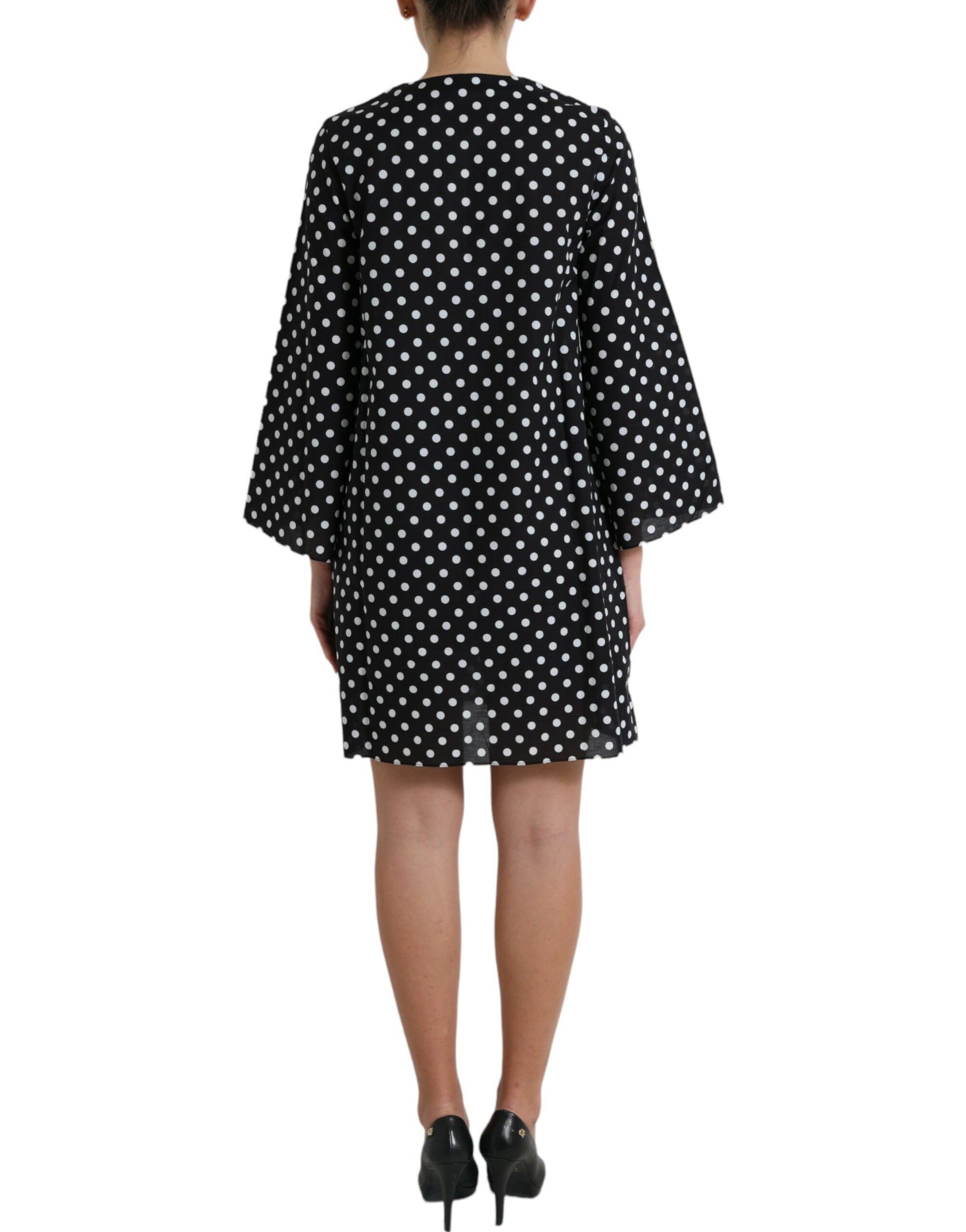 A black and white polka dot nylon shift mini dress