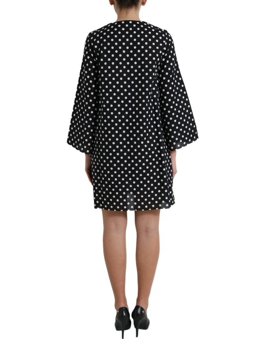 A black and white polka dot nylon shift mini dress