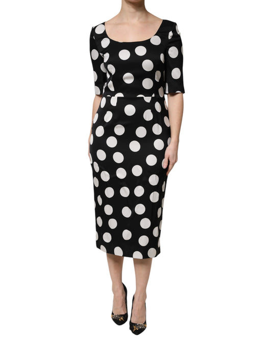 A black and white polka dot silk midi dress from Dolce & Gabbana