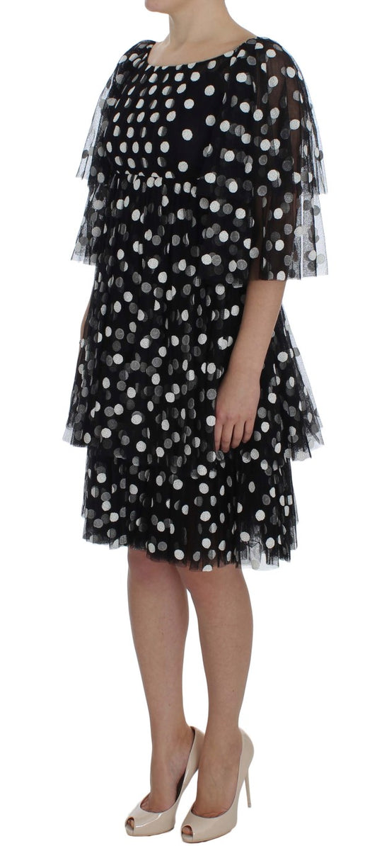 Black dress with white polka dots and ruffled sleeves