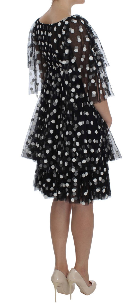 Black dress with white polka dots and ruffled sleeves