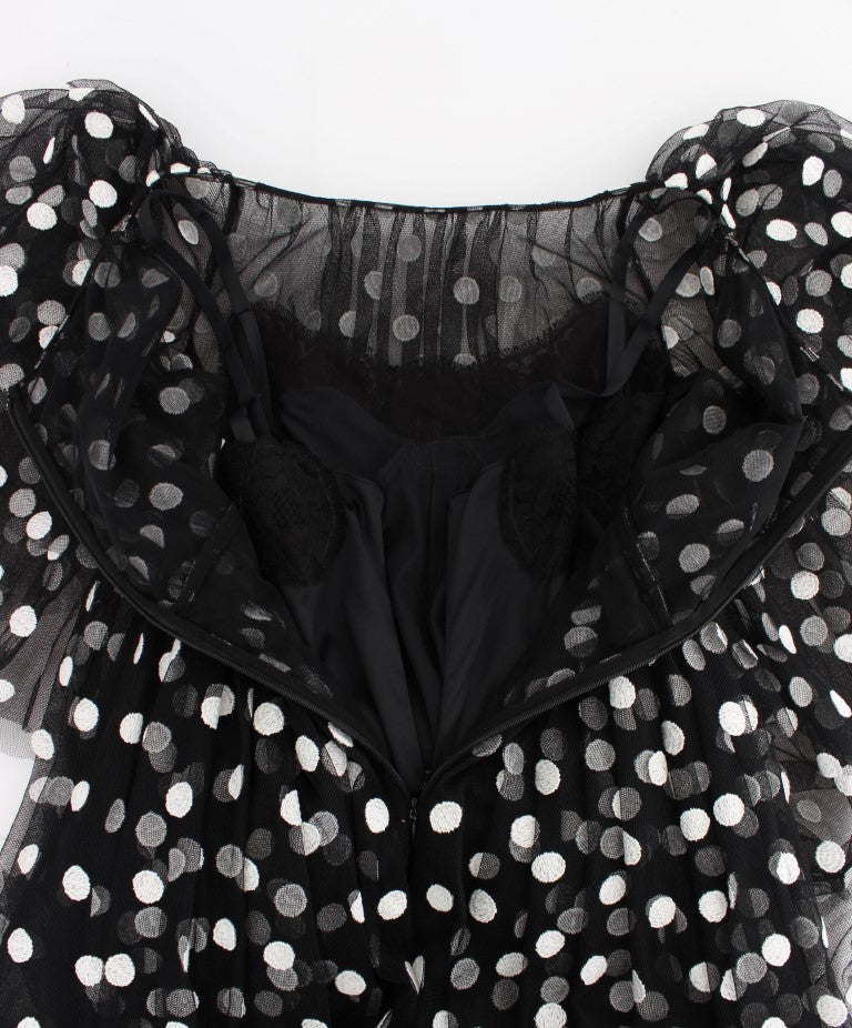 Black dress with polka dots on bodice and sleeves