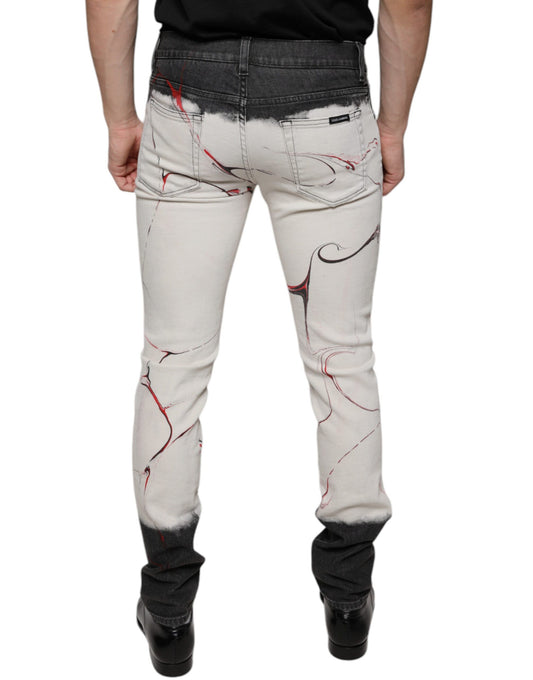 Pair of distressed jeans with red splatter design