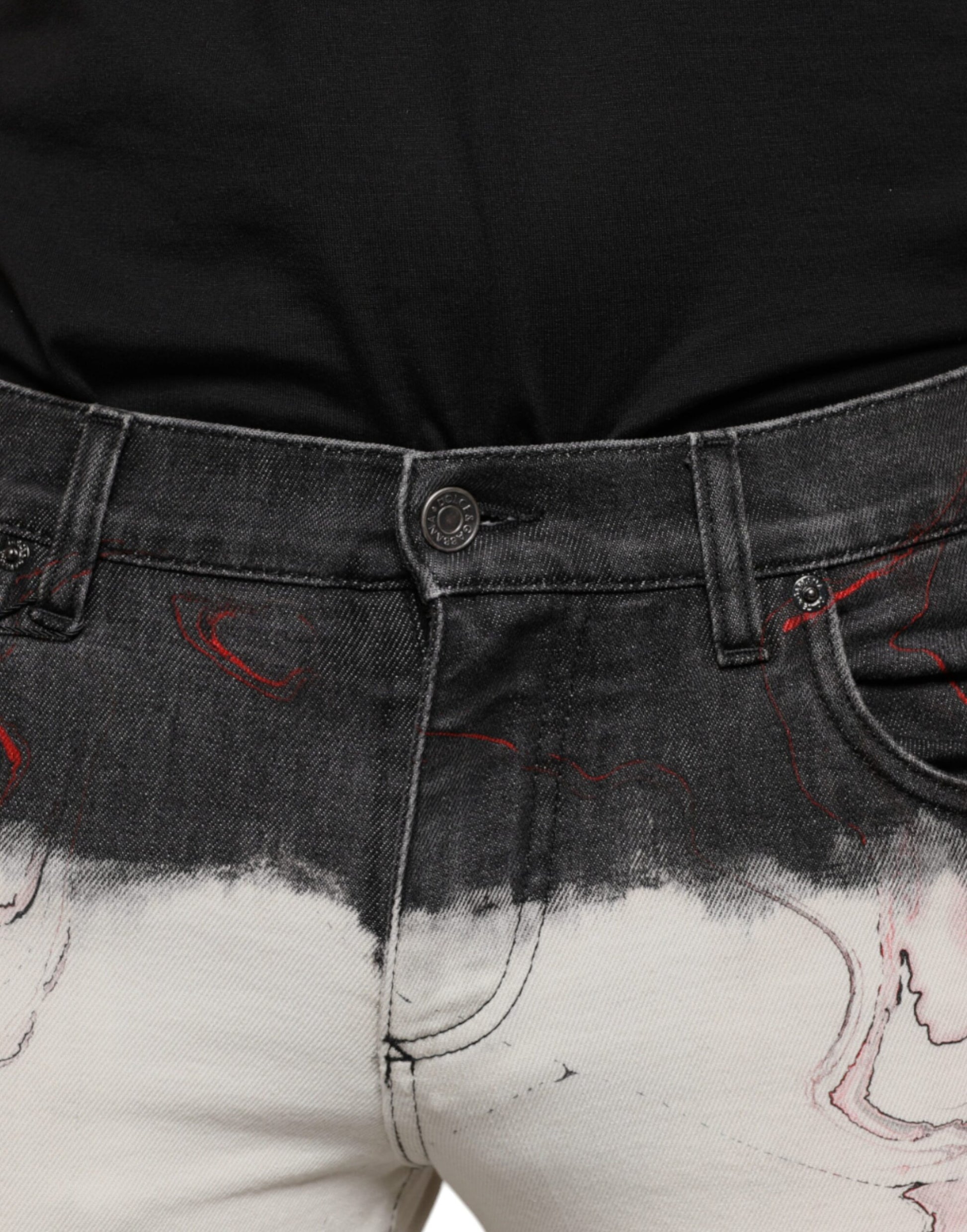 Distressed denim jeans with red splatter design