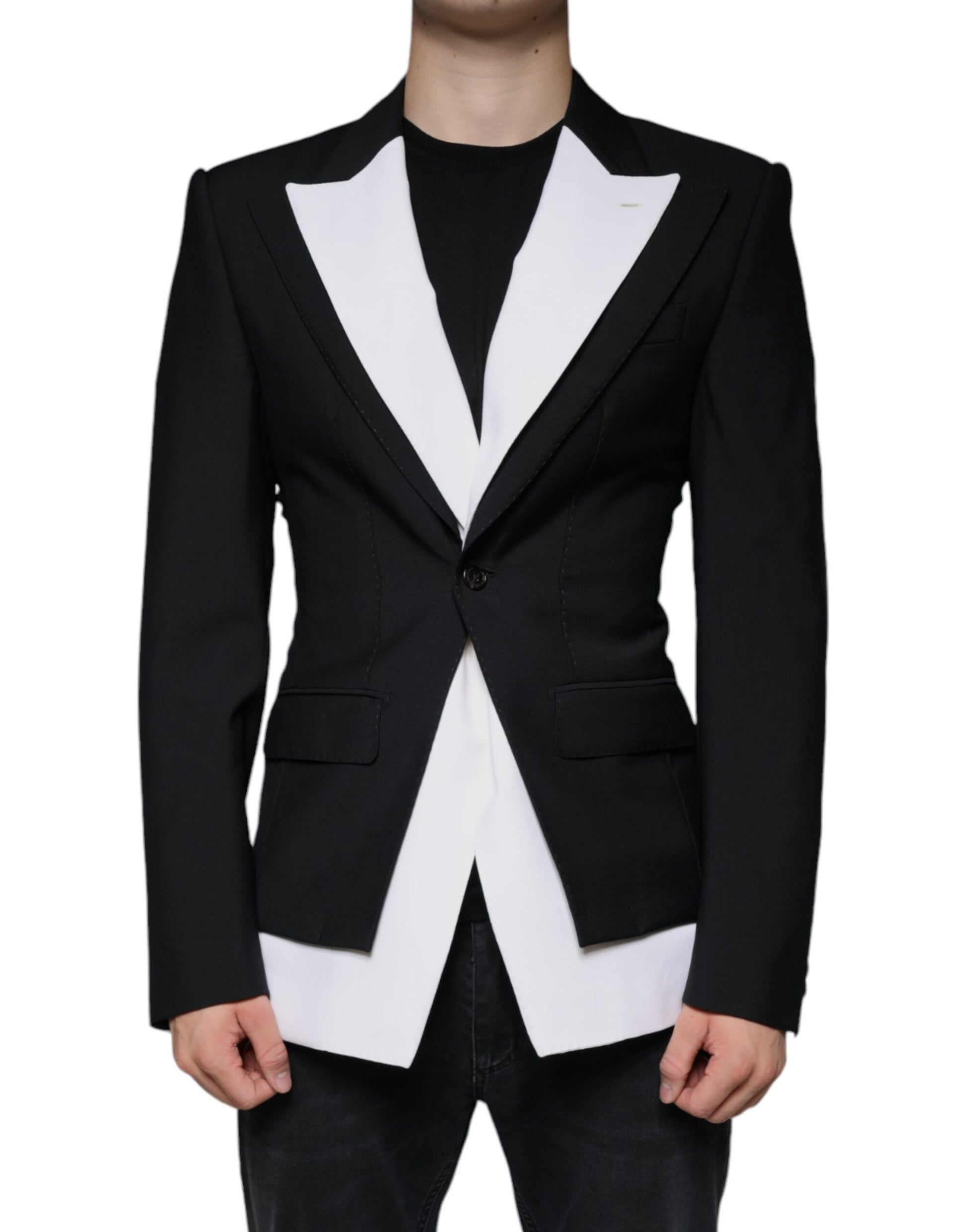 A black and white single-breasted blazer with a lapel collar, worn by a mannequin