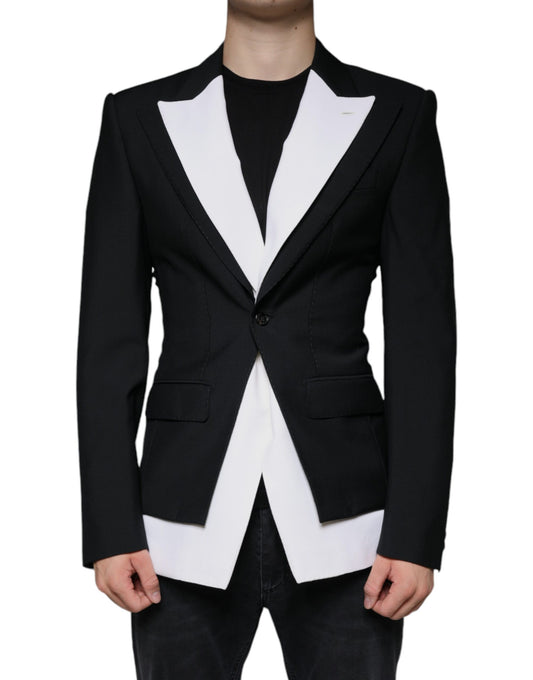 A black and white single-breasted blazer with a lapel collar, worn by a mannequin