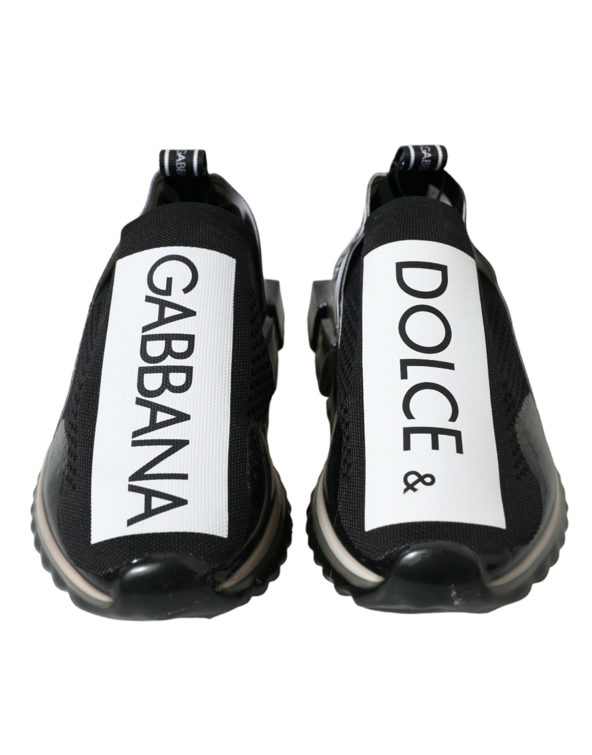 Pair of black and white sneakers with brand names on side