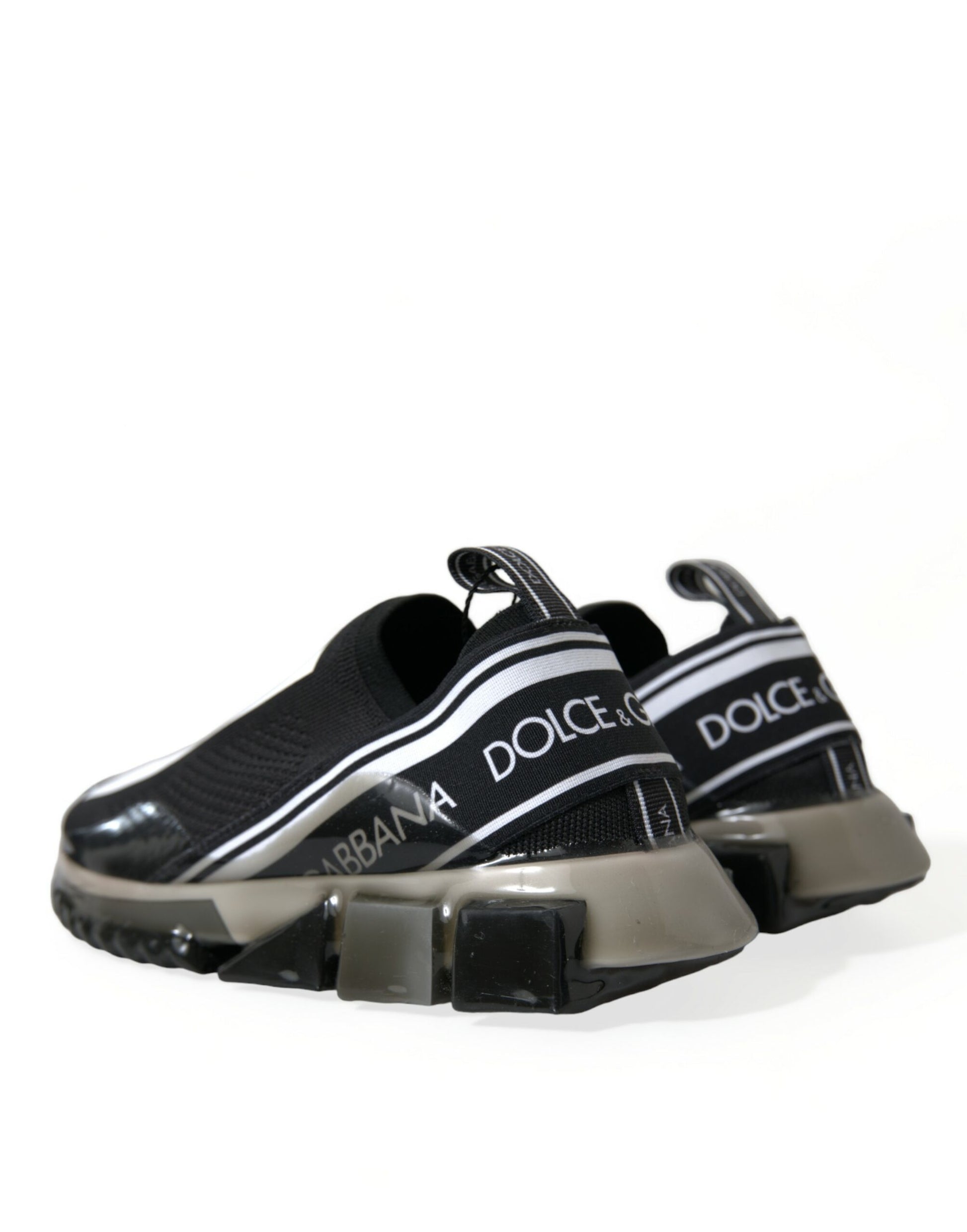 Pair of black and white sneakers with a logo on the side