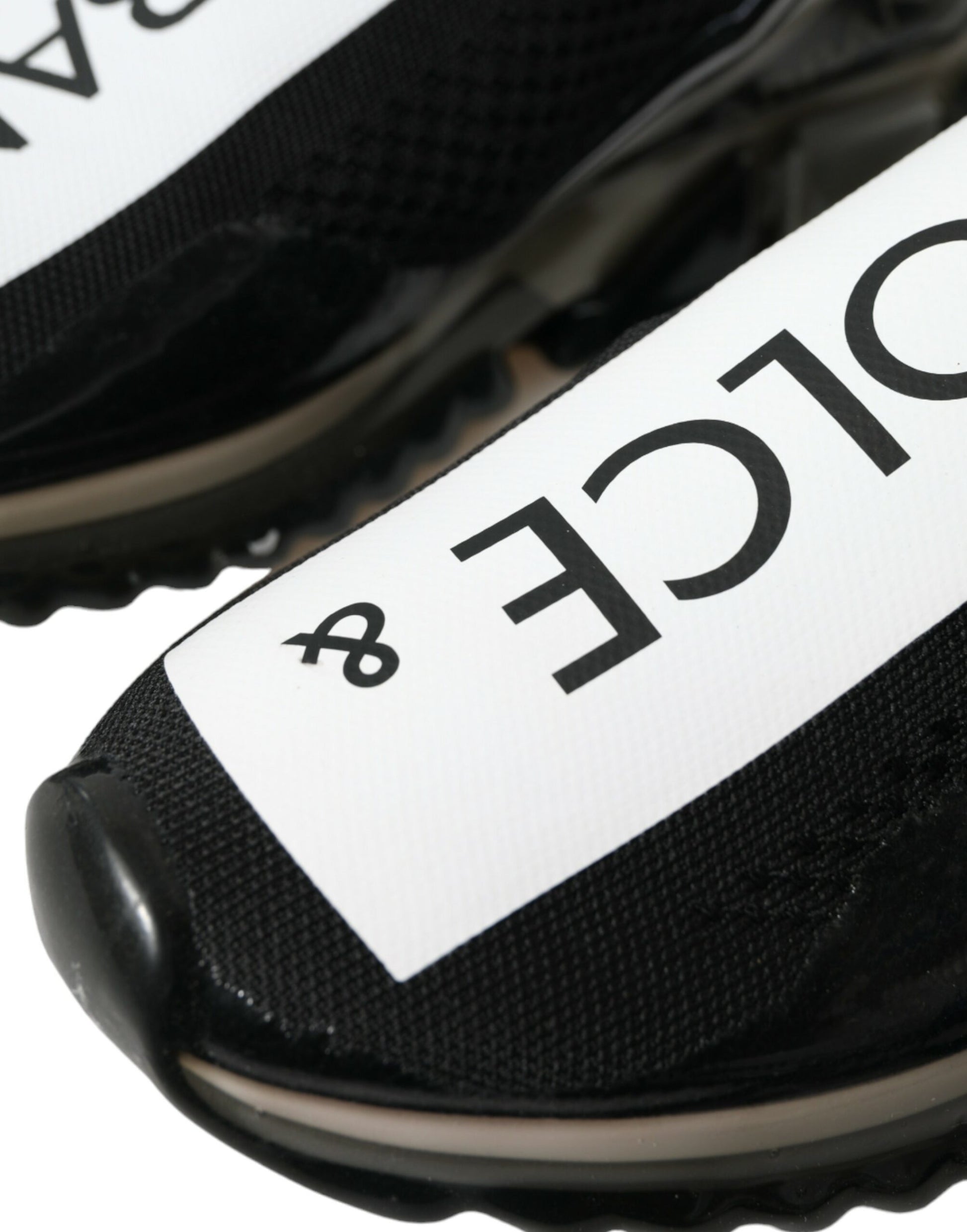 Pair of black and white sneakers with a logo on the side