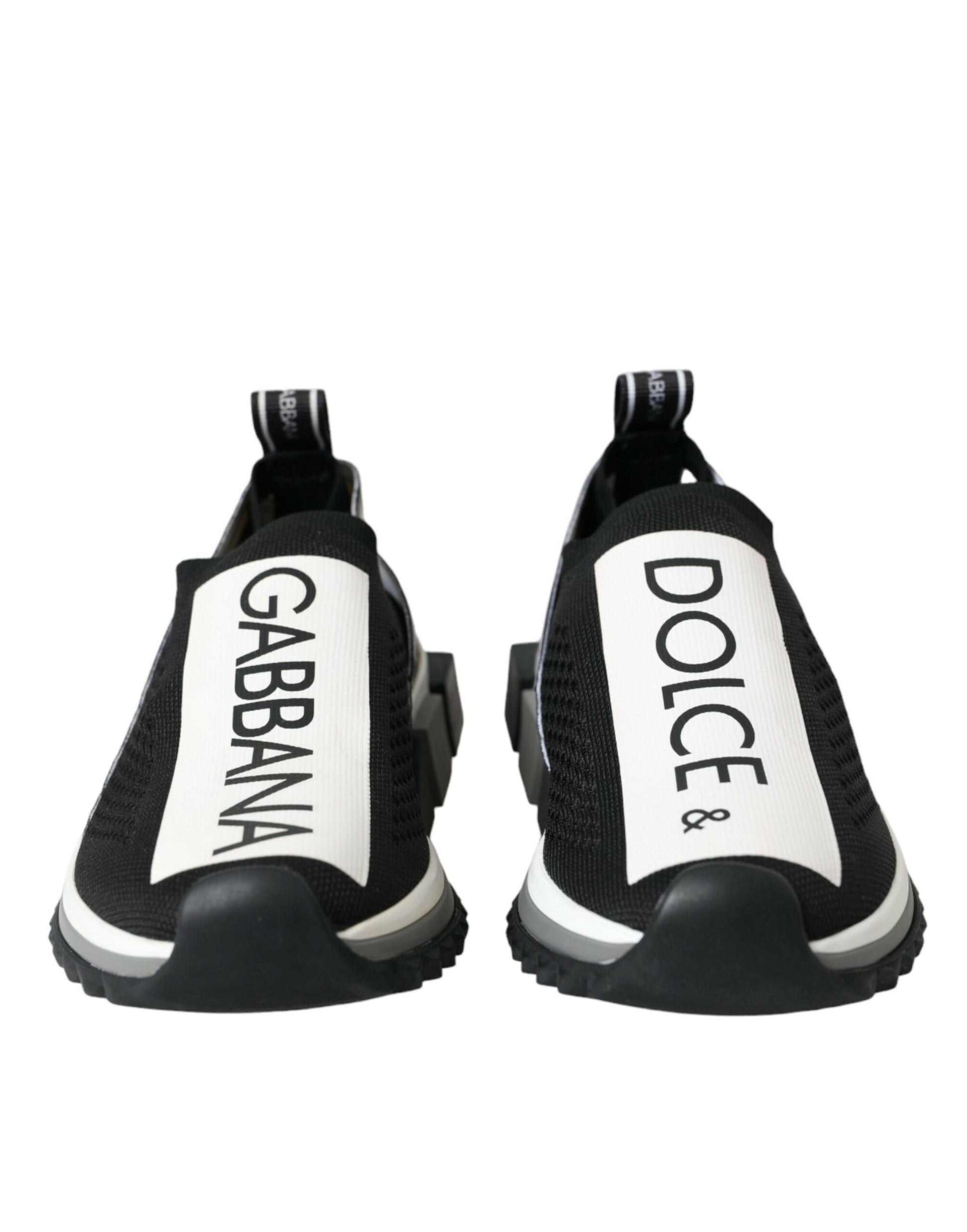 Pair of black sneakers with white soles and brand names on sides