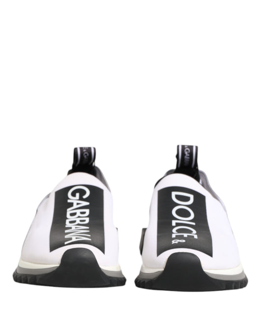 Pair of black and white slip-on shoes with brand name on side
