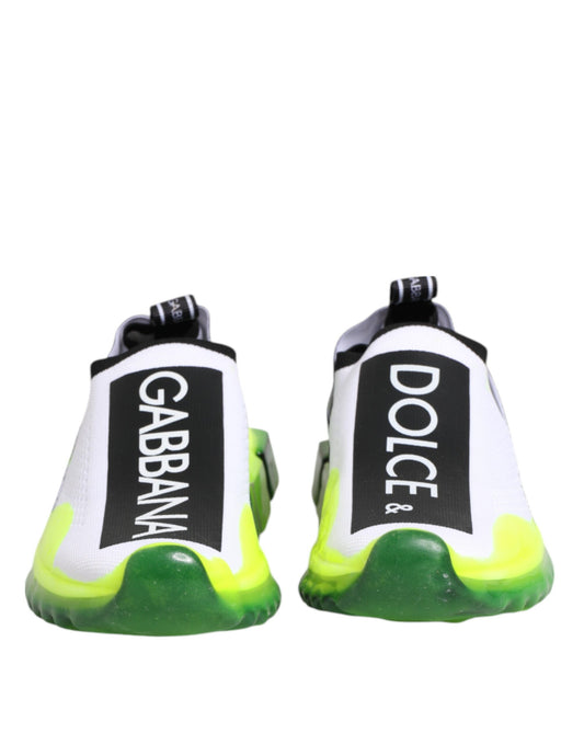 Pair of black and white slip-on shoes with brand name on side, featuring a checkered pattern