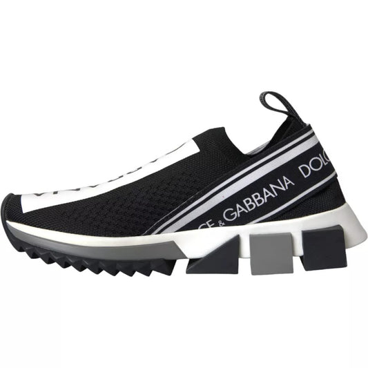 A pair of black and white slip-on shoes with the Dolce & Gabbana logo