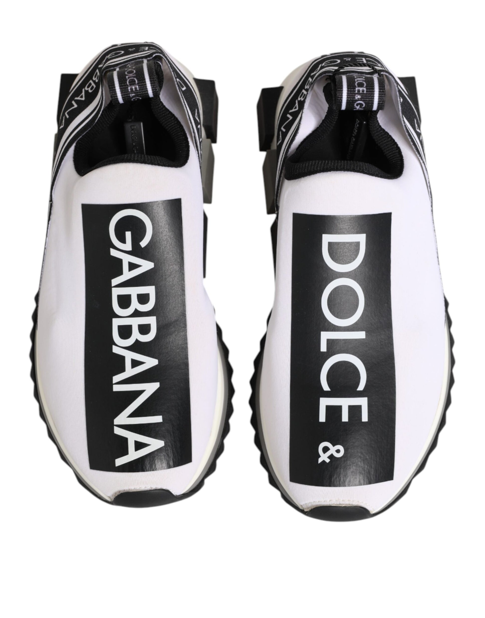Pair of black and white slip-on shoes with Dolce & Gabbana branding