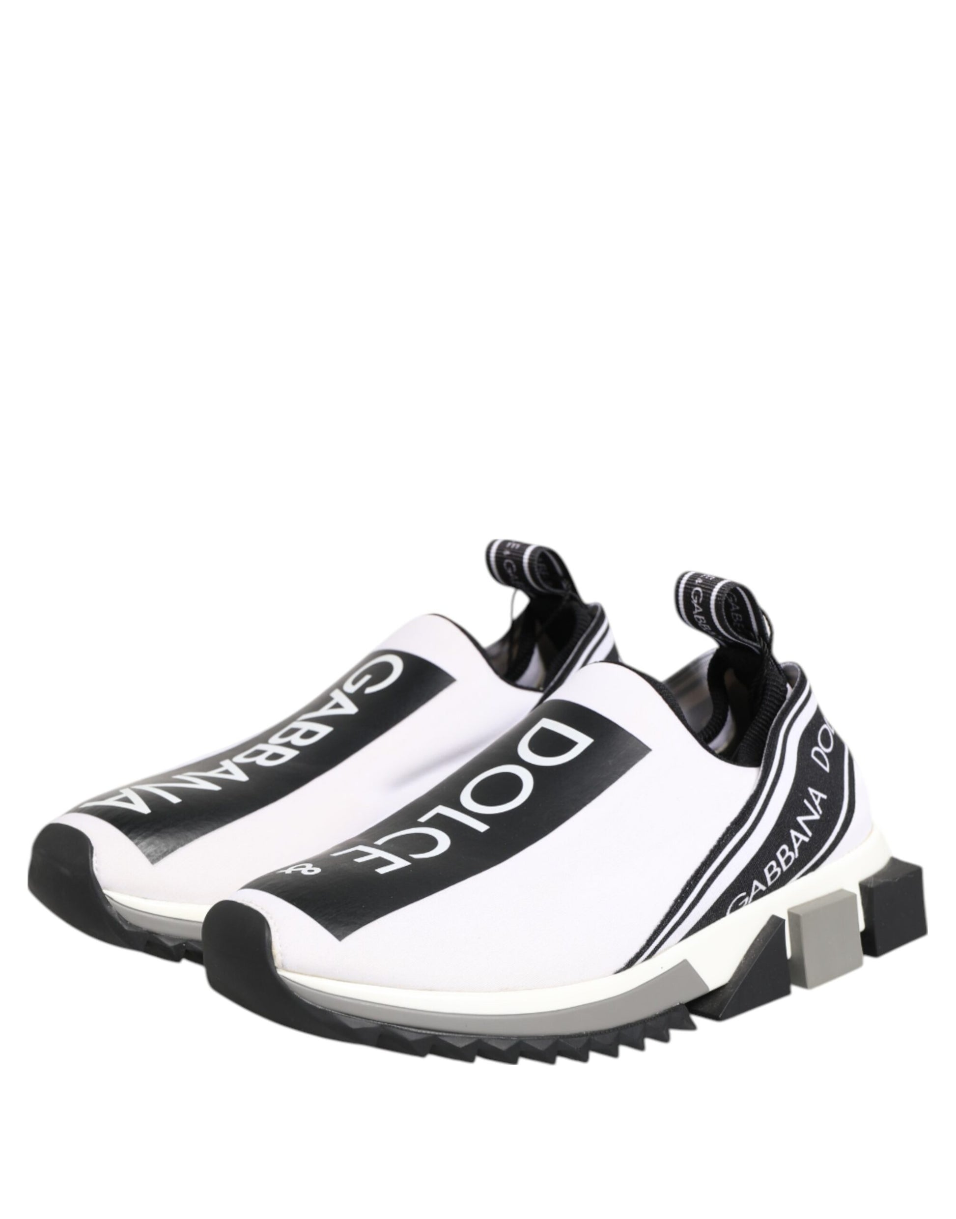 A pair of black and white slip-on shoes with the Dolce & Gabbana logo