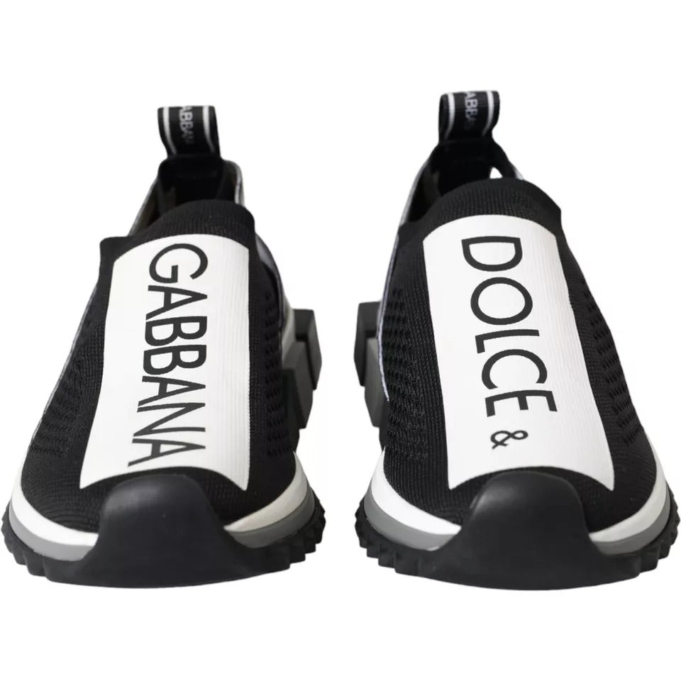 A pair of black and white slip-on shoes with the brand name "Dolce & Gabbana" visible on the side