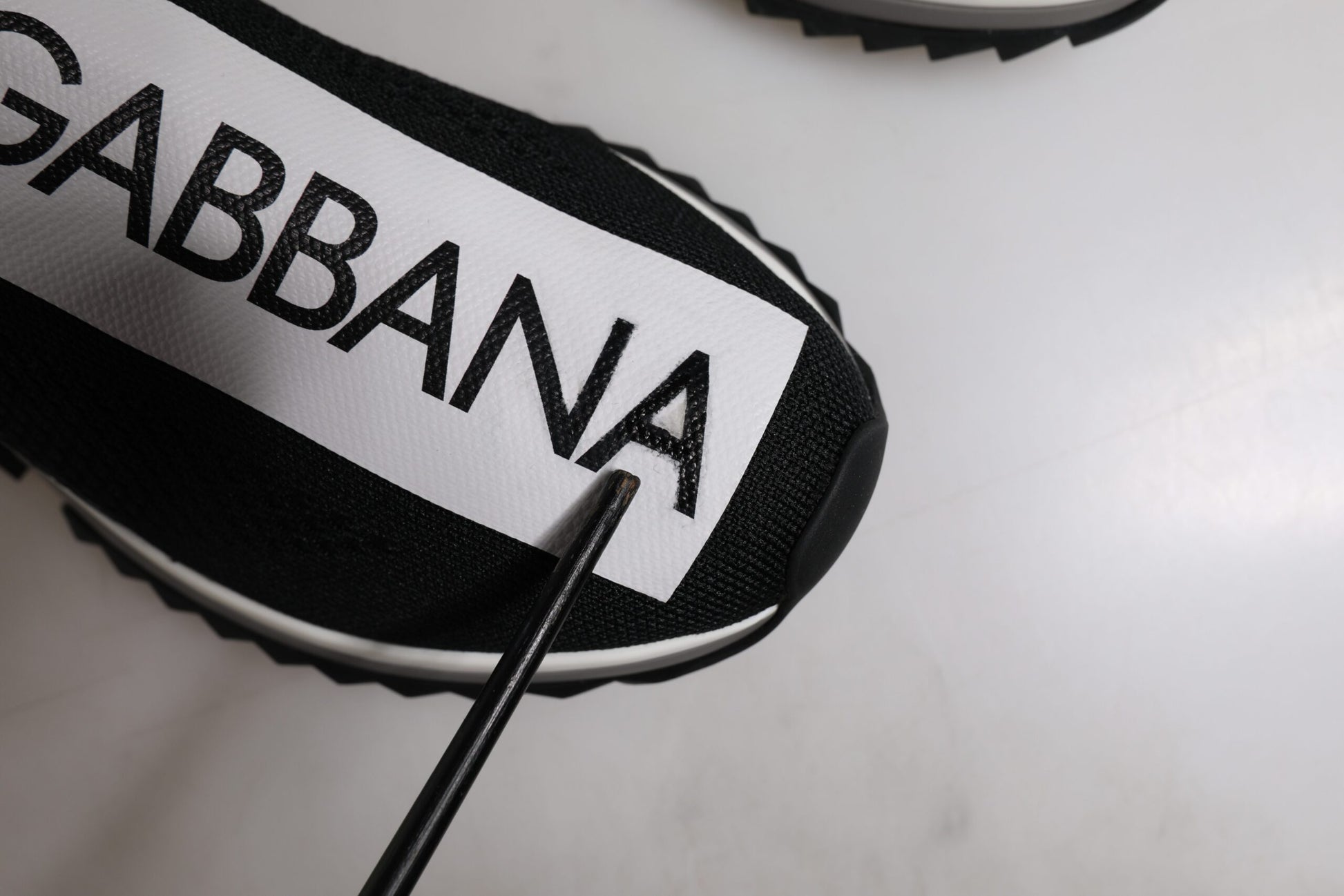 Black and white soccer jersey with brand name on front