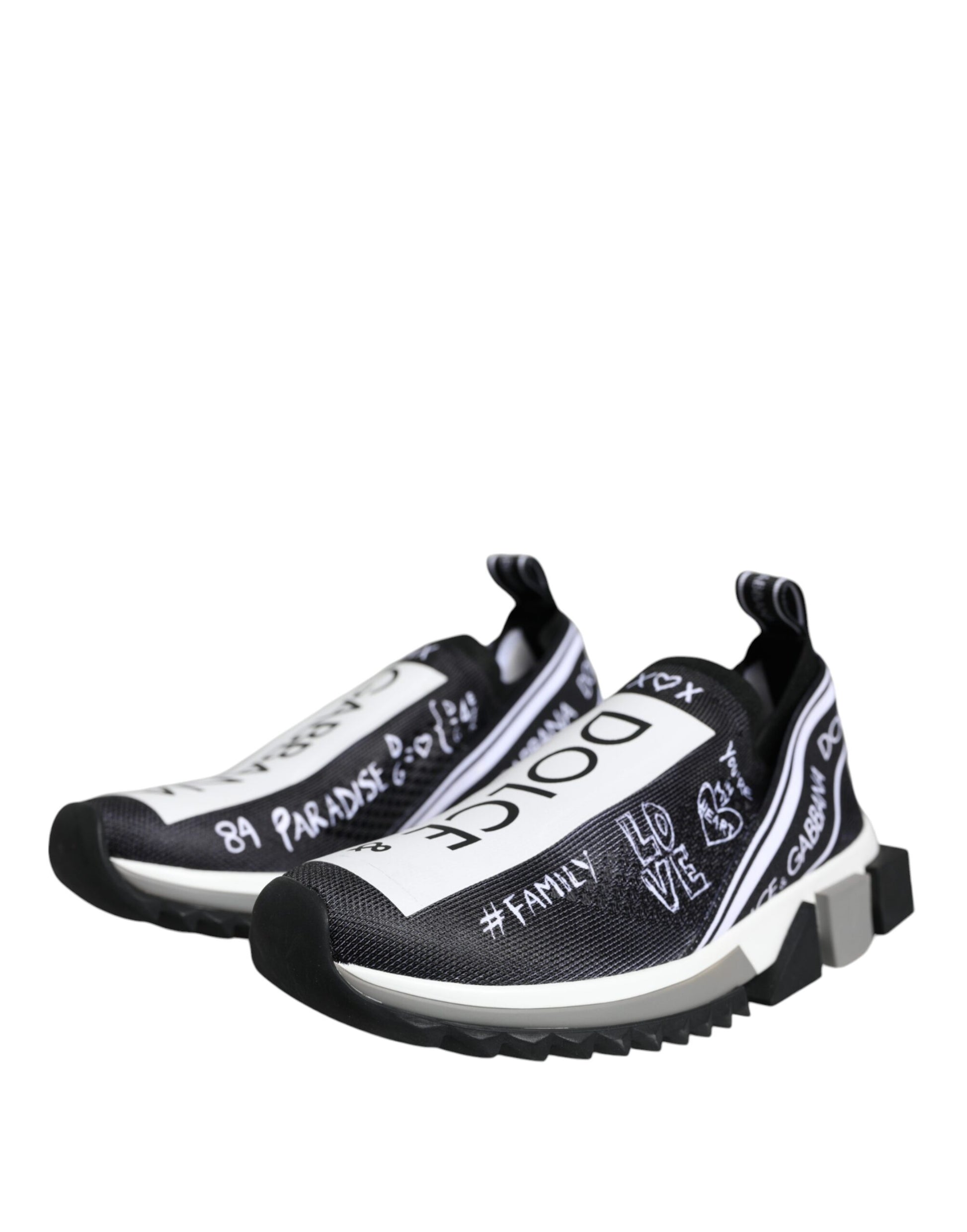 Pair of black and white sneakers with writing on them