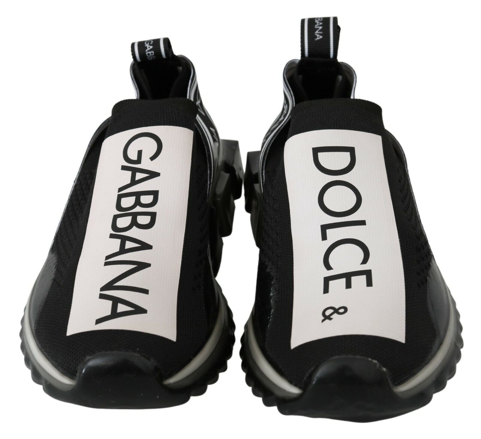 Pair of black and white sneakers with brand names on side
