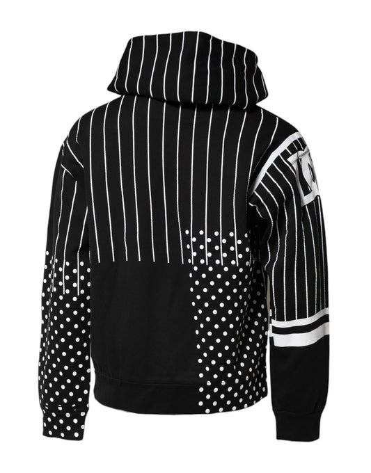 Black hoodie with white stripes and polka dots on sleeves