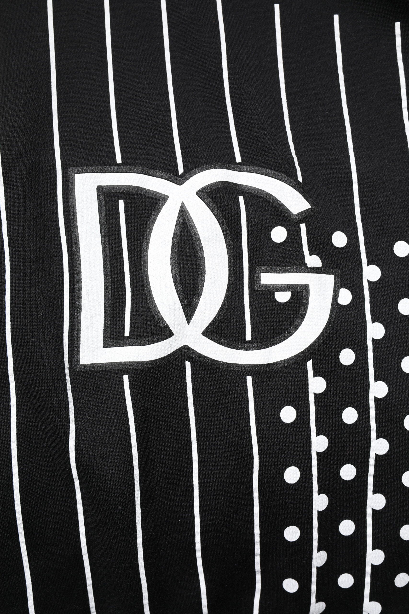 Black and white striped fabric with a logo in the center