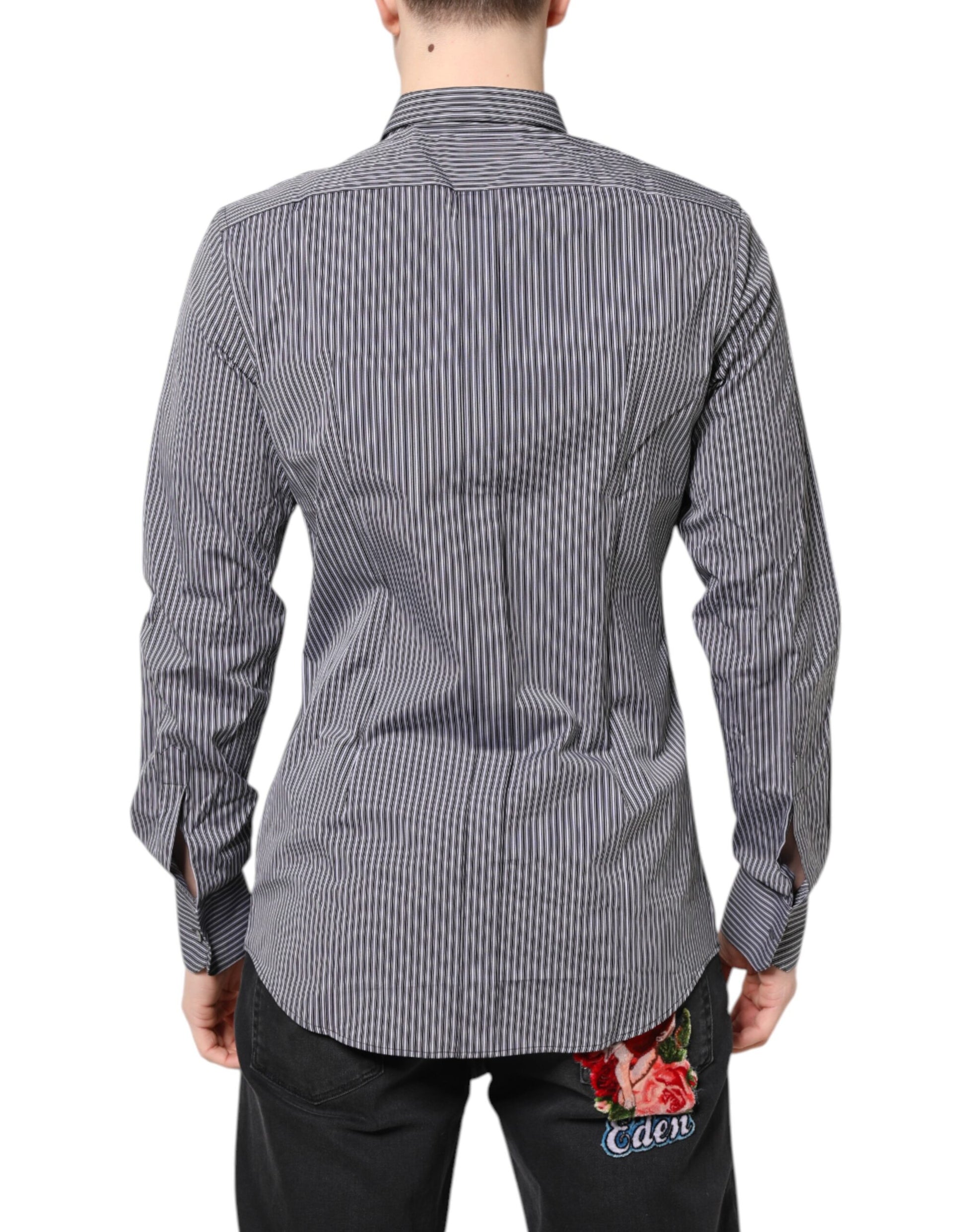 A black and white striped formal dress shirt with gold accents, designed by Dolce & Gabbana