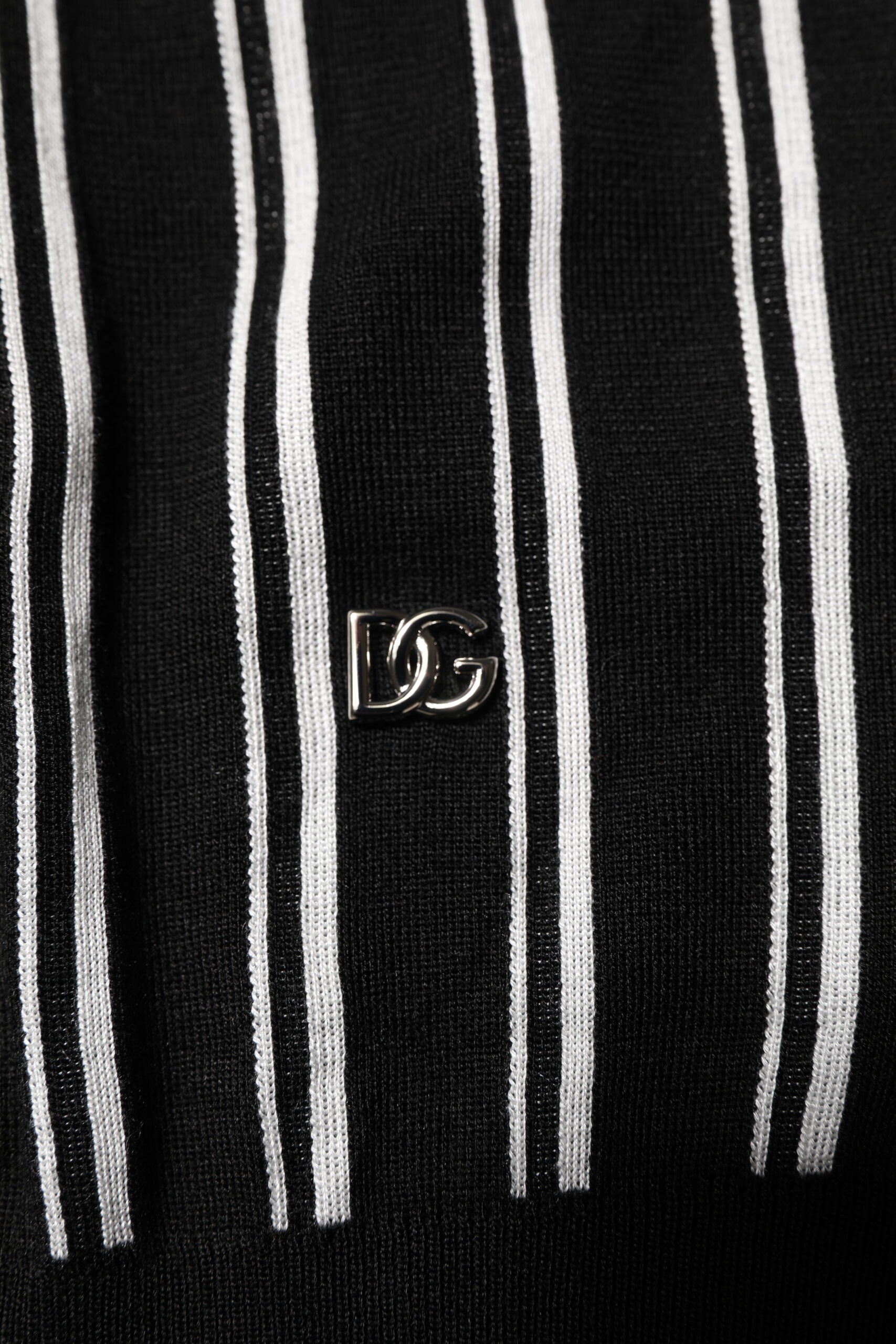 Black tie with white stripes and a silver logo