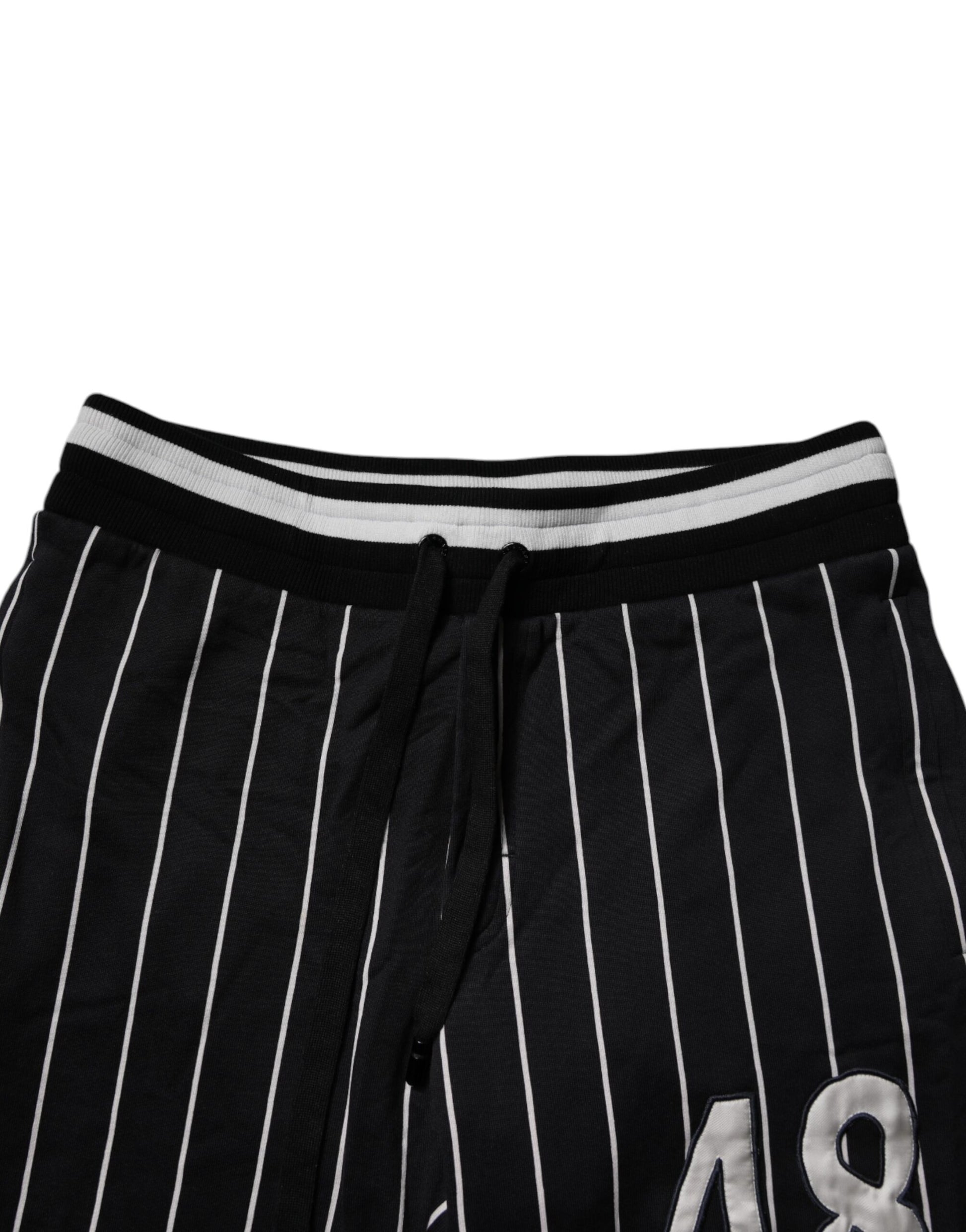 Black shorts with white stripes and a number on the leg