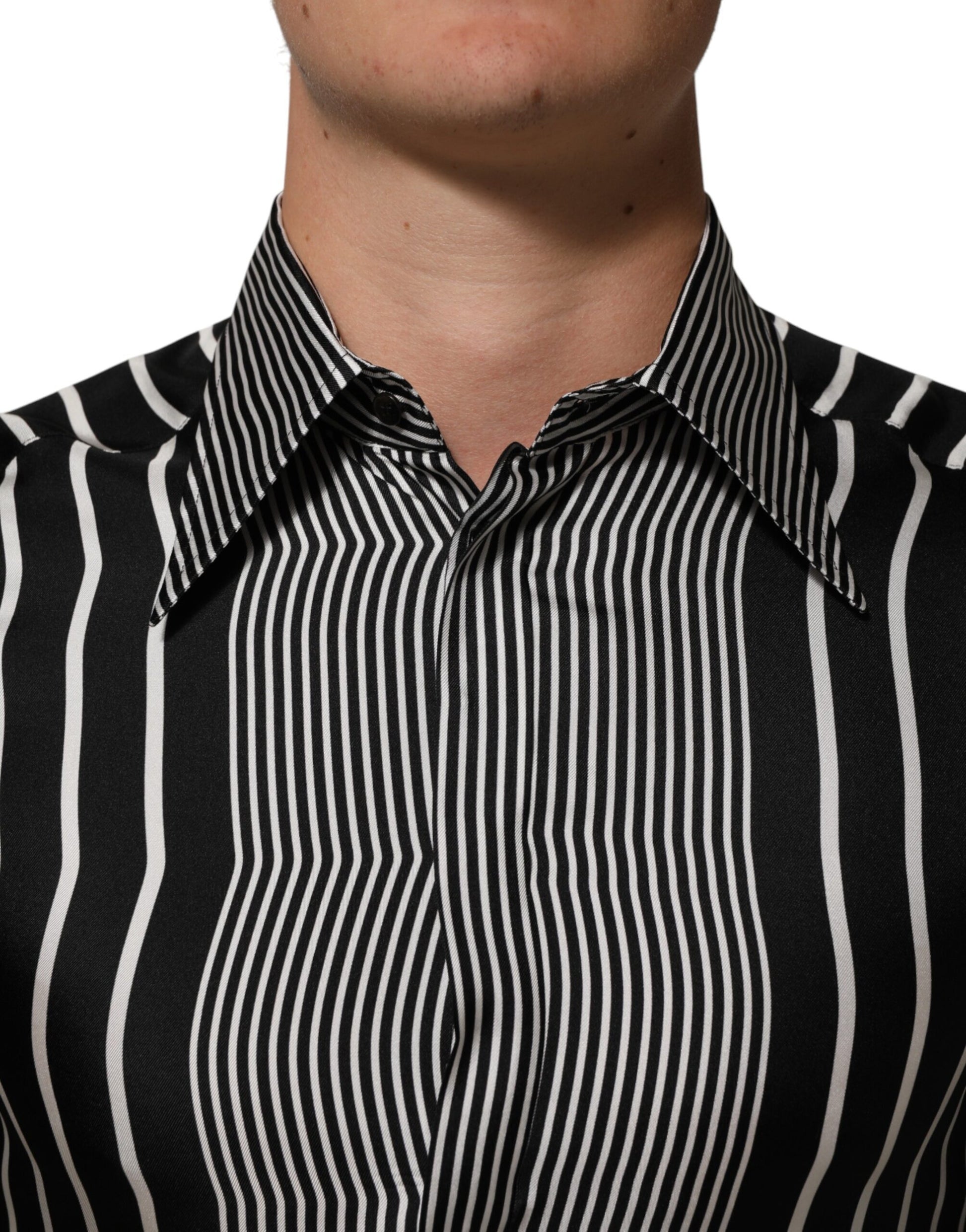 A black and white striped men's dress shirt with a collar, long sleeves, and button-down front